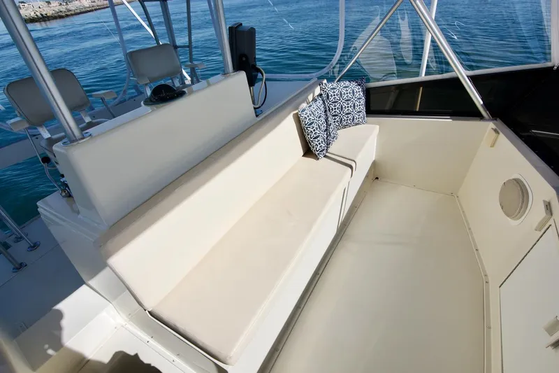 3 Hour Tour Yacht Photos Pics 1989 Viking Convertible boat interior with cushioned seating and ocean view.