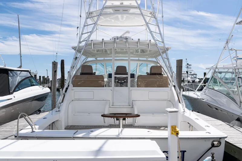  Yacht Photos Pics 2014 Viking 42 Express yacht docked at marina under clear blue sky.