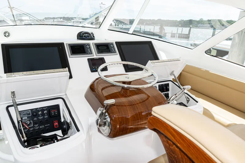  Yacht Photos Pics Helm of 2014 Viking 42 Express yacht with modern controls and navigation screens.