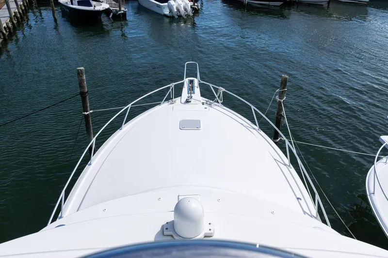  Yacht Photos Pics Bow view of 2014 Viking 42 Express yacht docked in marina.