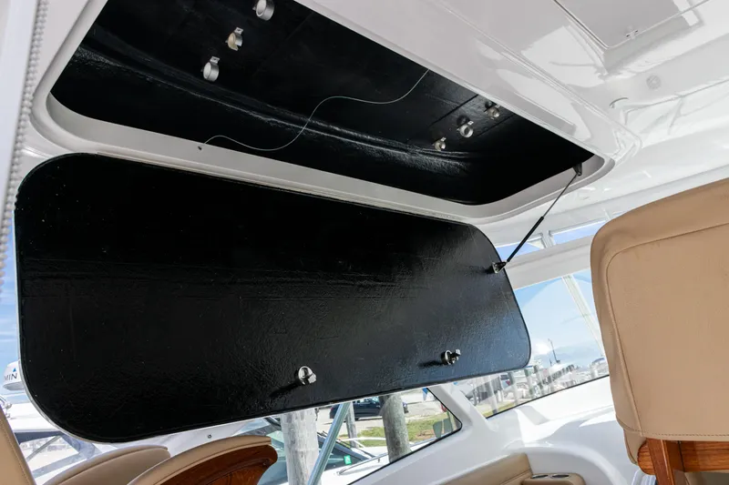  Yacht Photos Pics 2014 Viking 42 Express yacht interior with open overhead storage compartment.