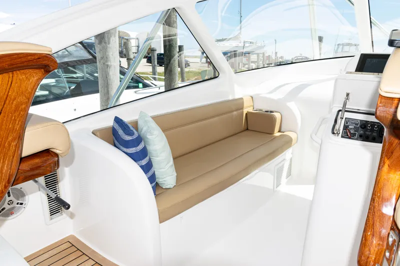  Yacht Photos Pics Interior of 2014 Viking 42 Express yacht with beige seating and decorative pillows.