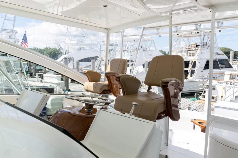  Yacht Photos Pics Interior of 2014 Viking 42 Express yacht with luxurious seating and marina view.
