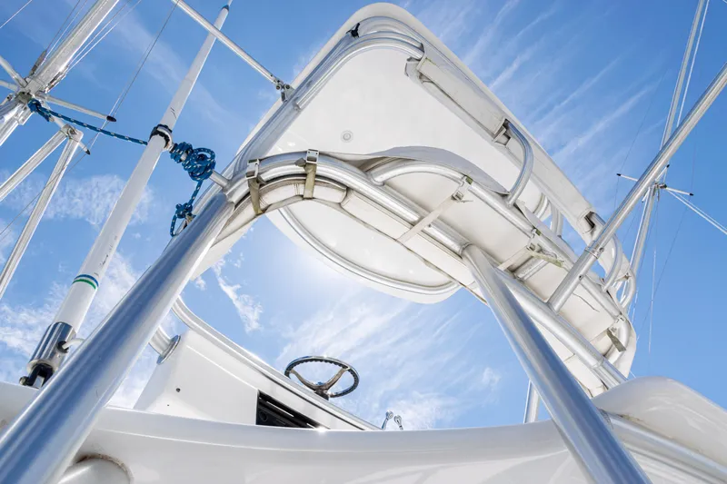  Yacht Photos Pics 2014 Viking 42 Express yacht, viewed from below, showcasing sleek design against a clear blue sky.