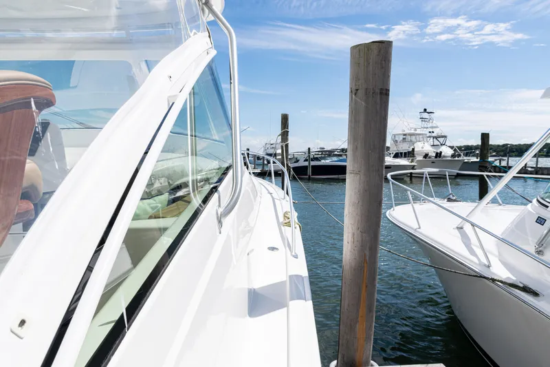  Yacht Photos Pics 2014 Viking 42 Express yacht docked at marina under clear blue sky.