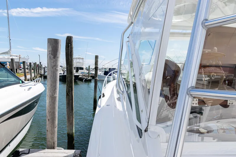  Yacht Photos Pics 2014 Viking 42 Express yacht docked at a marina under a clear blue sky.