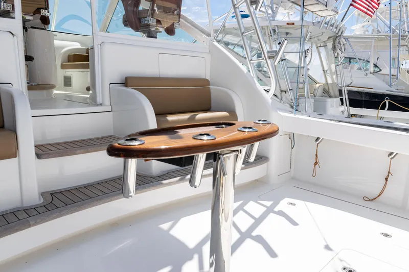  Yacht Photos Pics 2014 Viking 42 Express yacht interior with seating and polished wood table.