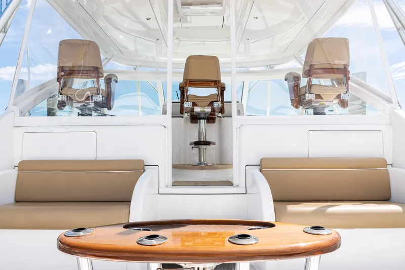  Yacht Photos Pics 2014 Viking 42 Express yacht interior with seating and helm chairs.