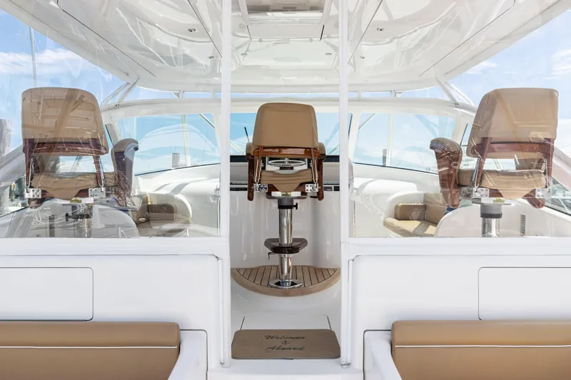  Yacht Photos Pics 2014 Viking 42 Express yacht cockpit with beige seating and modern helm station.