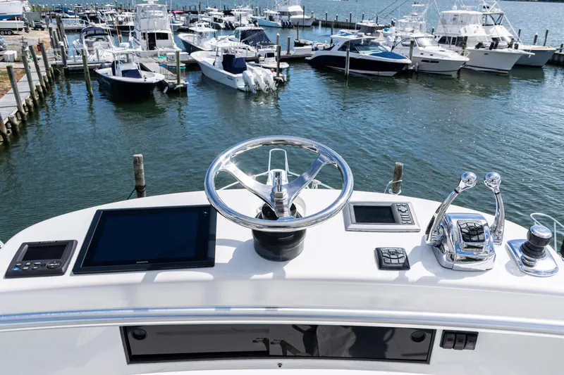  Yacht Photos Pics Helm of 2014 Viking 42 Express yacht with marina view.