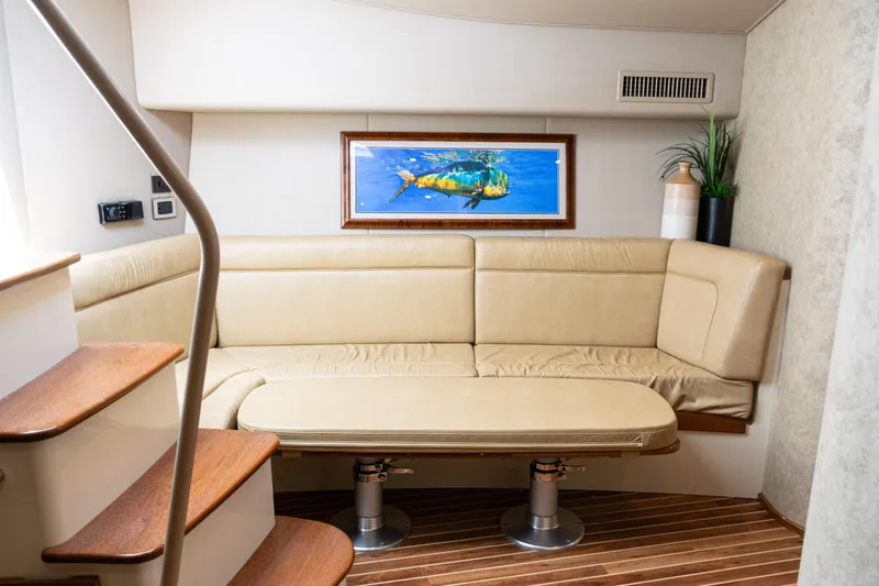  Yacht Photos Pics Luxurious interior of 2014 Viking 42 Express yacht with beige seating and marine artwork.