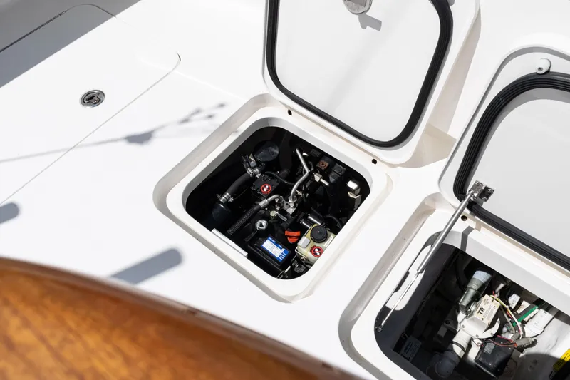  Yacht Photos Pics Open engine compartment of 2014 Viking 42 Express boat, showcasing mechanical components.