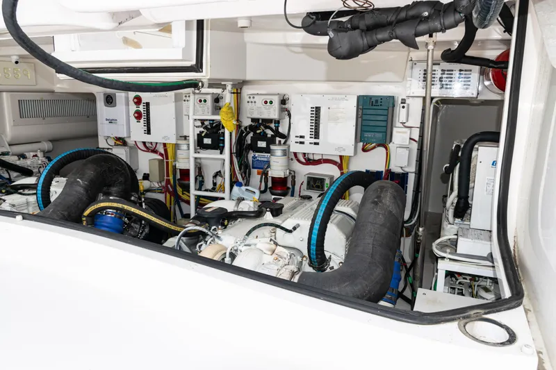  Yacht Photos Pics Engine room of 2014 Viking 42 Express yacht, showcasing complex machinery and wiring.