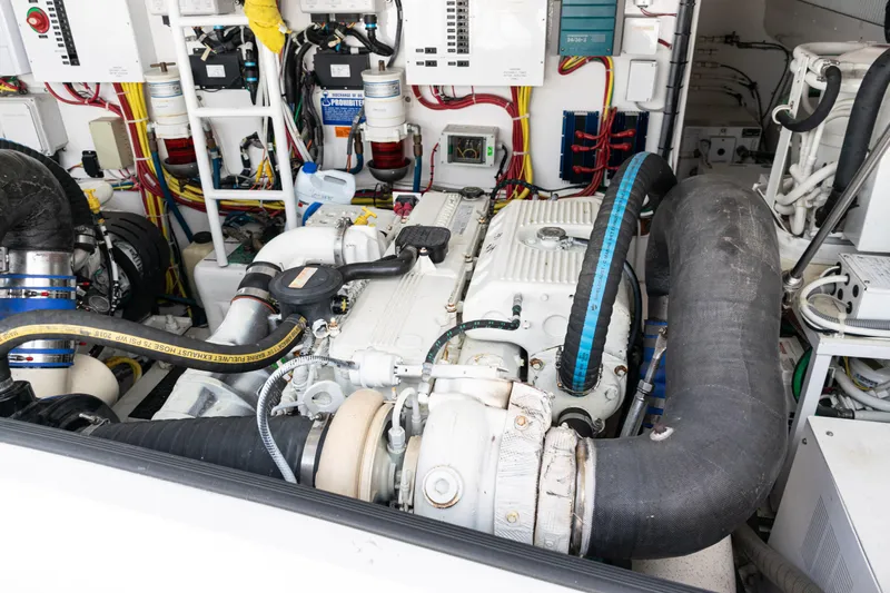  Yacht Photos Pics Engine room of a 2014 Viking 42 Express yacht, showcasing complex machinery and wiring.