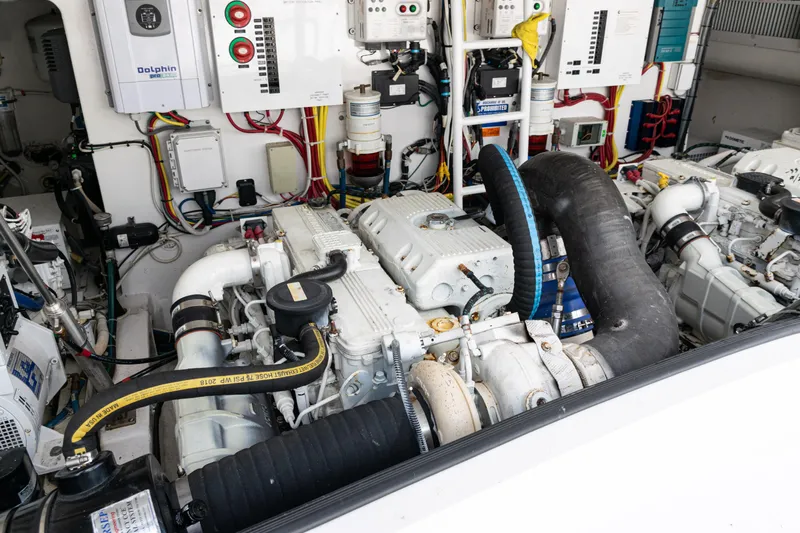  Yacht Photos Pics Engine room of a 2014 Viking 42 Express yacht, showcasing complex machinery and wiring.