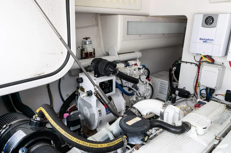  Yacht Photos Pics Engine room of 2014 Viking 42 Express yacht, showcasing mechanical components and wiring.