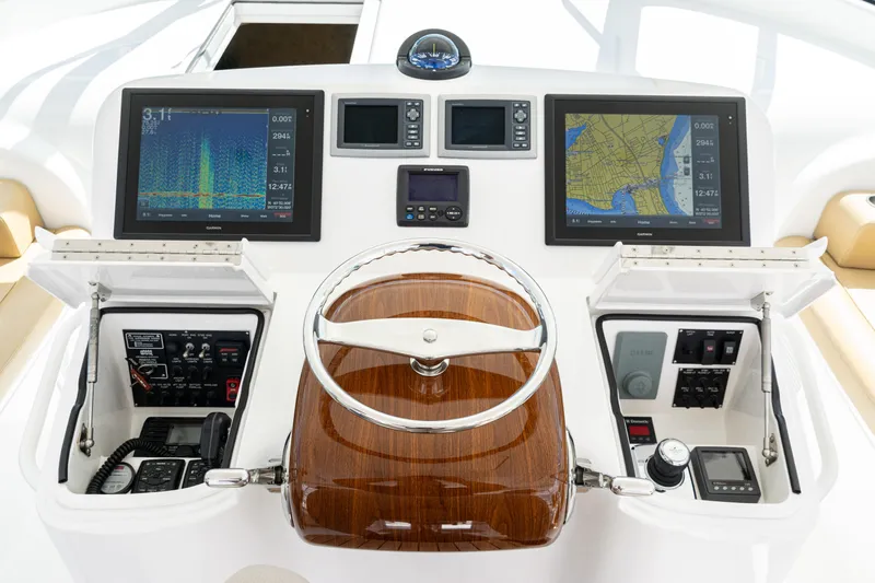  Yacht Photos Pics Helm of 2014 Viking 42 Express yacht with navigation screens and controls.