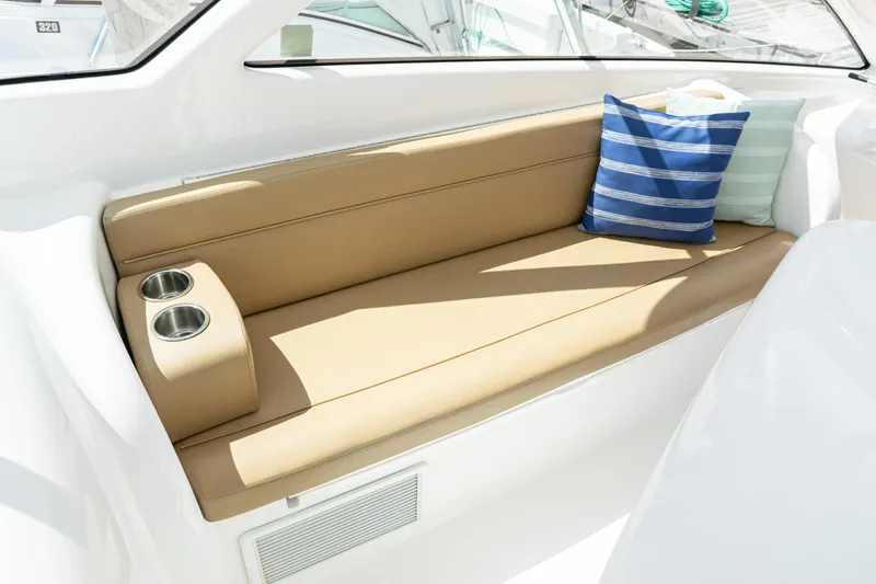  Yacht Photos Pics Luxurious seating area on 2014 Viking 42 Express yacht with cushions and cup holders.
