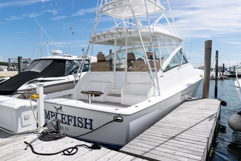  Yacht Photos Pics 2014 Viking 42 Express yacht docked at marina under clear blue sky.