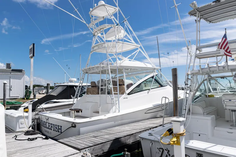  Yacht Photos Pics 2014 Viking 42 Express yacht docked at marina under clear blue sky.