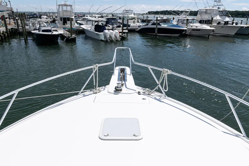  Yacht Photos Pics Bow view of 2014 Viking 42 Express yacht docked at marina.