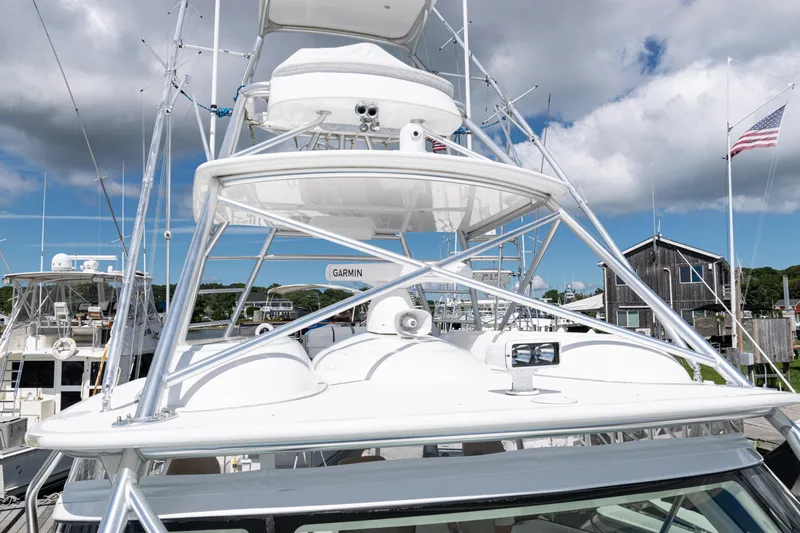  Yacht Photos Pics 2014 Viking 42 Express yacht with tower, docked under cloudy sky.