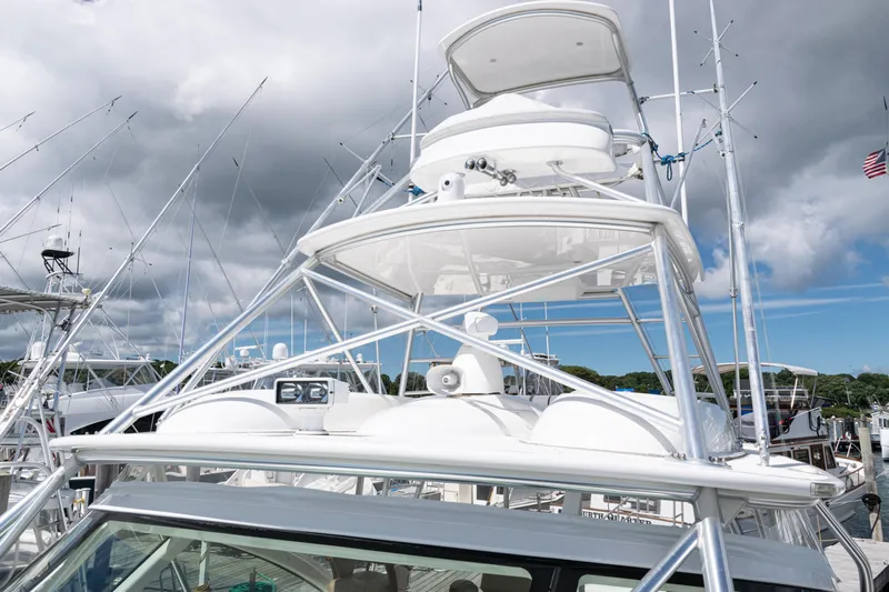  Yacht Photos Pics 2014 Viking 42 Express yacht with tower against cloudy sky at marina.