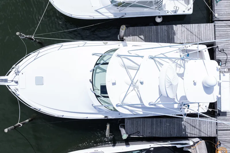  Yacht Photos Pics Aerial view of a 2014 Viking 42 Express yacht docked at a marina.