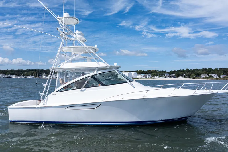  Yacht Photos Pics 2014 Viking 42 Express yacht cruising on a sunny day with blue skies.