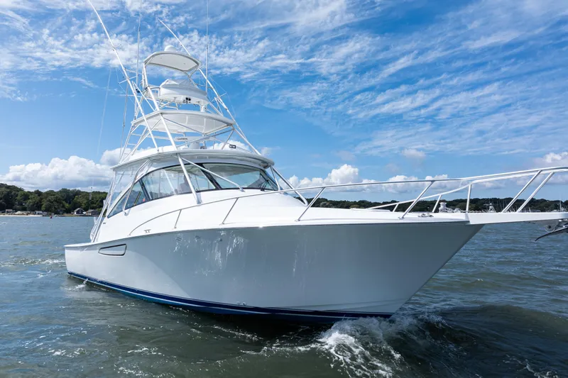  Yacht Photos Pics 2014 Viking 42 Express yacht cruising on a sunny day with blue skies.