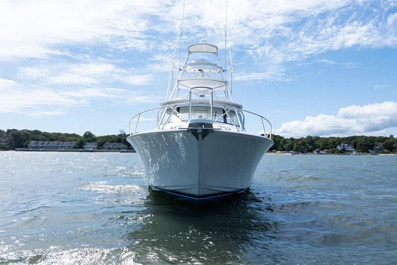  Yacht Photos Pics 2014 Viking 42 Express yacht on water under blue sky.