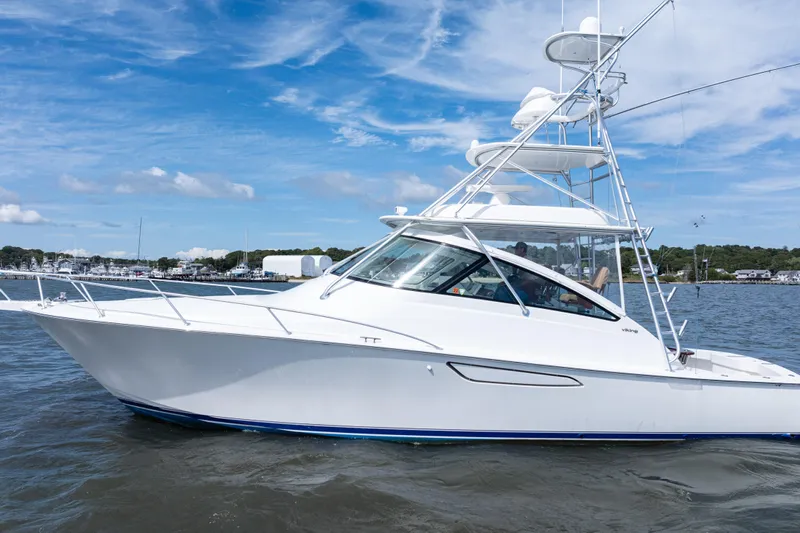  Yacht Photos Pics 2014 Viking 42 Express yacht cruising on a sunny day with blue skies.