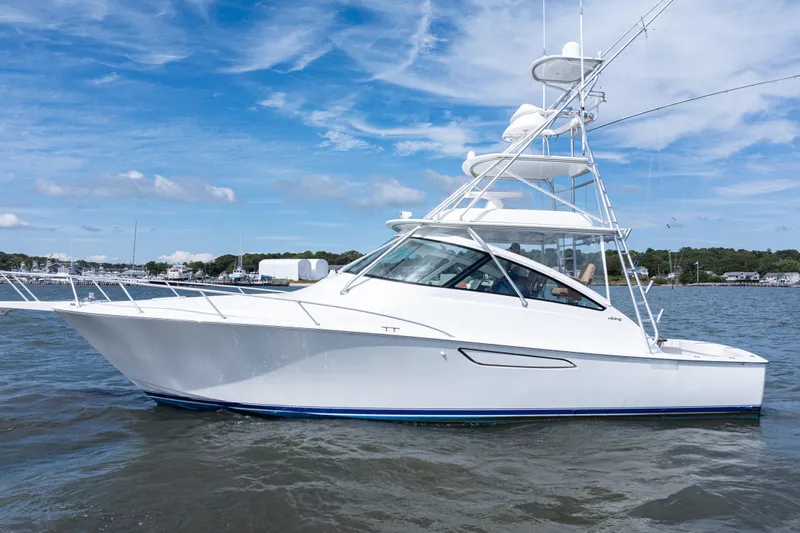  Yacht Photos Pics 2014 Viking 42 Express yacht on water under blue sky.