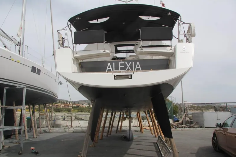  Yacht Photos Pics 2013 Beneteau Sense 43 sailboat "Alexia" on dry dock, rear view.