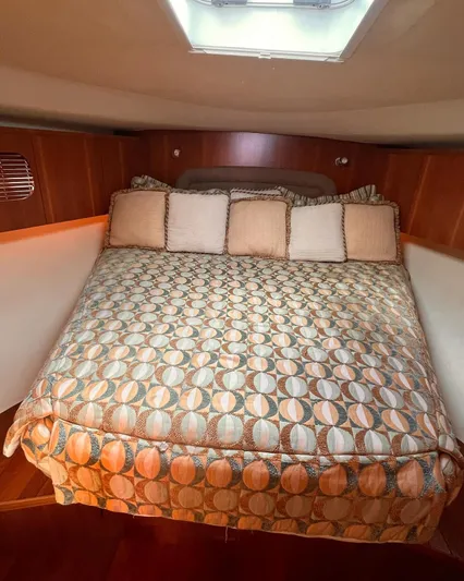  Yacht Photos Pics Luxurious bedroom interior of 2008 Tiara Yachts 4700 Sovran with patterned bedding.