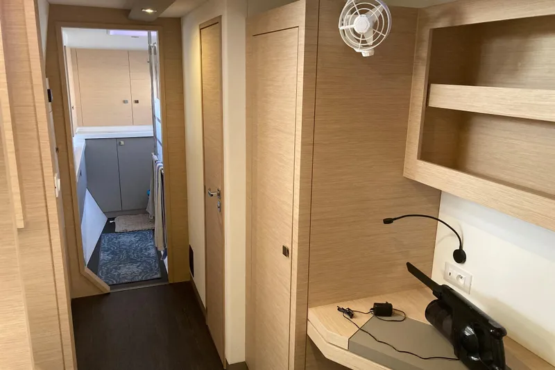  Yacht Photos Pics Interior of 2024 Fountaine Pajot Catamaran Astrea 42, featuring modern wood finish and compact design.