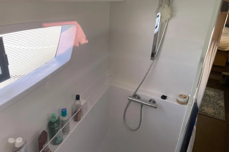 Yacht Photos Pics 2024 Fountaine Pajot Catamaran Astrea 42 bathroom with shower and toiletries.
