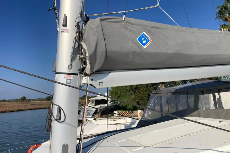  Yacht Photos Pics 2024 Fountaine Pajot Catamaran Astrea 42 mast and sail cover on a sunny day.