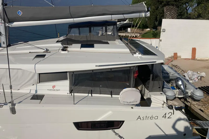  Yacht Photos Pics 2024 Fountaine Pajot Astrea 42 catamaran docked, featuring sleek design and modern amenities.