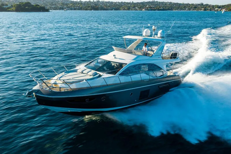  Yacht Photos Pics 2018 Azimut Flybridge yacht cruising on open water, showcasing luxury and performance.
