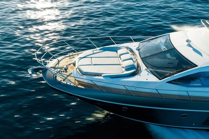  Yacht Photos Pics Luxurious 2018 Azimut Flybridge yacht cruising on sparkling blue water.