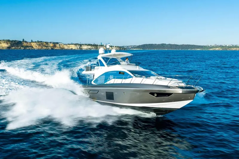  Yacht Photos Pics 2018 Azimut Flybridge yacht cruising on open blue sea.