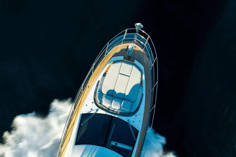  Yacht Photos Pics 2018 Azimut Flybridge yacht cruising on open water, aerial view.