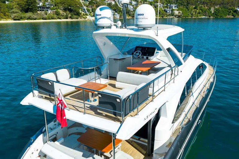  Yacht Photos Pics 2018 Azimut Flybridge yacht on serene water, featuring spacious deck and modern design.