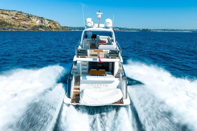  Yacht Photos Pics 2018 Azimut Flybridge yacht cruising on open blue sea, scenic coastal backdrop.