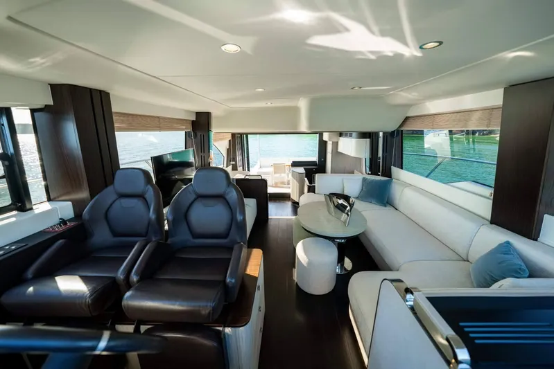  Yacht Photos Pics Luxurious interior of 2018 Azimut Flybridge yacht with modern seating and panoramic windows.