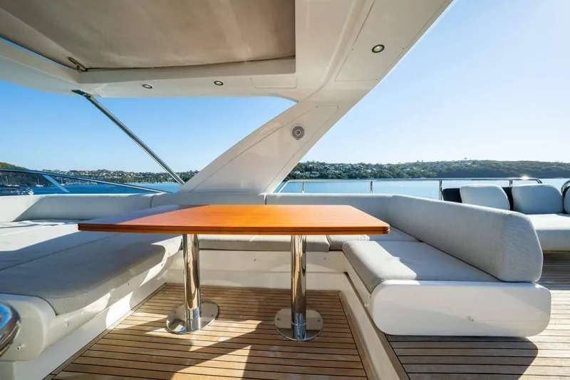  Yacht Photos Pics Luxurious 2018 Azimut Flybridge yacht deck with elegant seating and scenic water view.