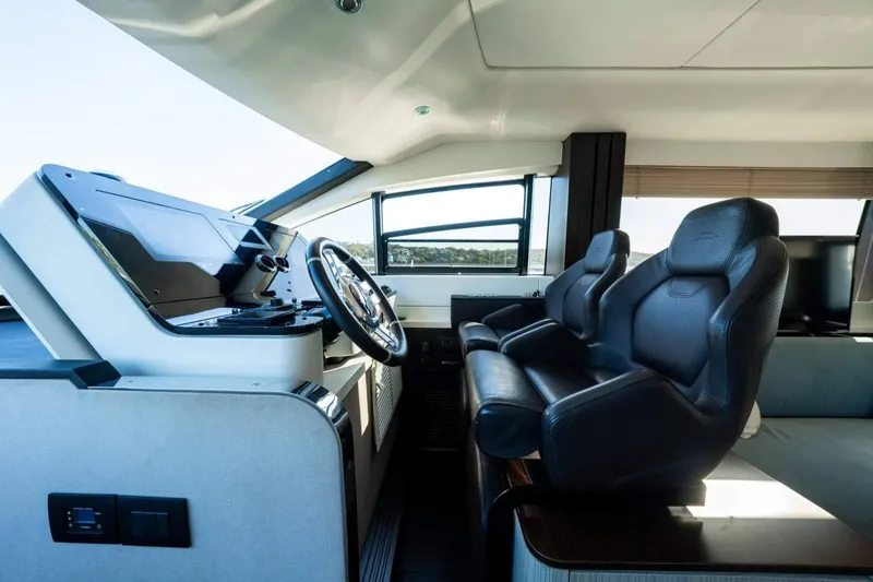  Yacht Photos Pics 2018 Azimut Flybridge yacht interior with modern helm and luxurious seating.