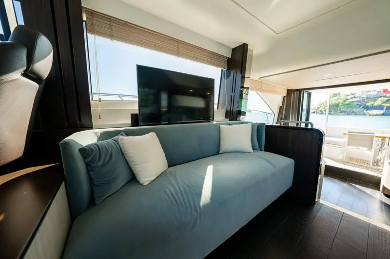  Yacht Photos Pics Luxurious interior of 2018 Azimut Flybridge yacht with modern sofa and large TV.