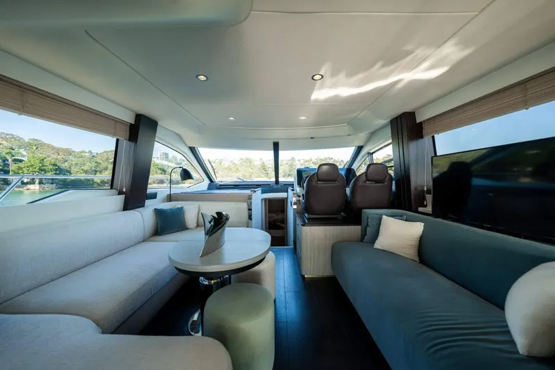  Yacht Photos Pics Luxurious interior of 2018 Azimut Flybridge yacht with modern seating and panoramic windows.